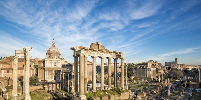 Roman Forum - the Temple of Saturn in the foreground, Rome, Italy.