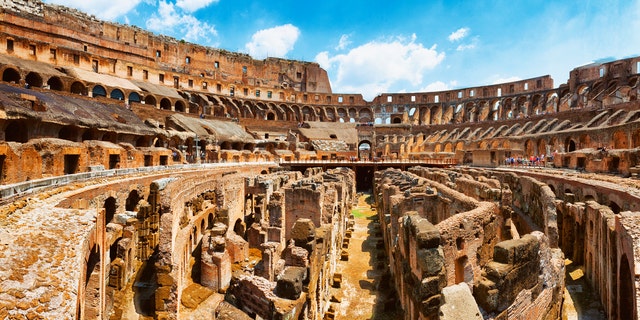 Panoramic shot of the interior of The Colosseum (Flavian Amphitheatre) in Rome, Italy. The Colosseum was constructed in the 1st century AD. Multiple files stitched.