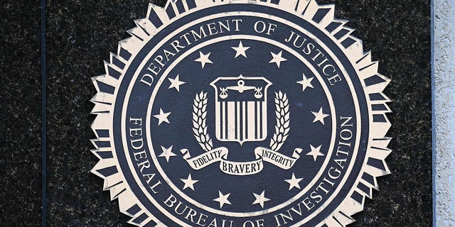 The seal of the Federal Bureau of Investigation is seen outside of its headquarters in Washington, DC on August 15, 2022. 