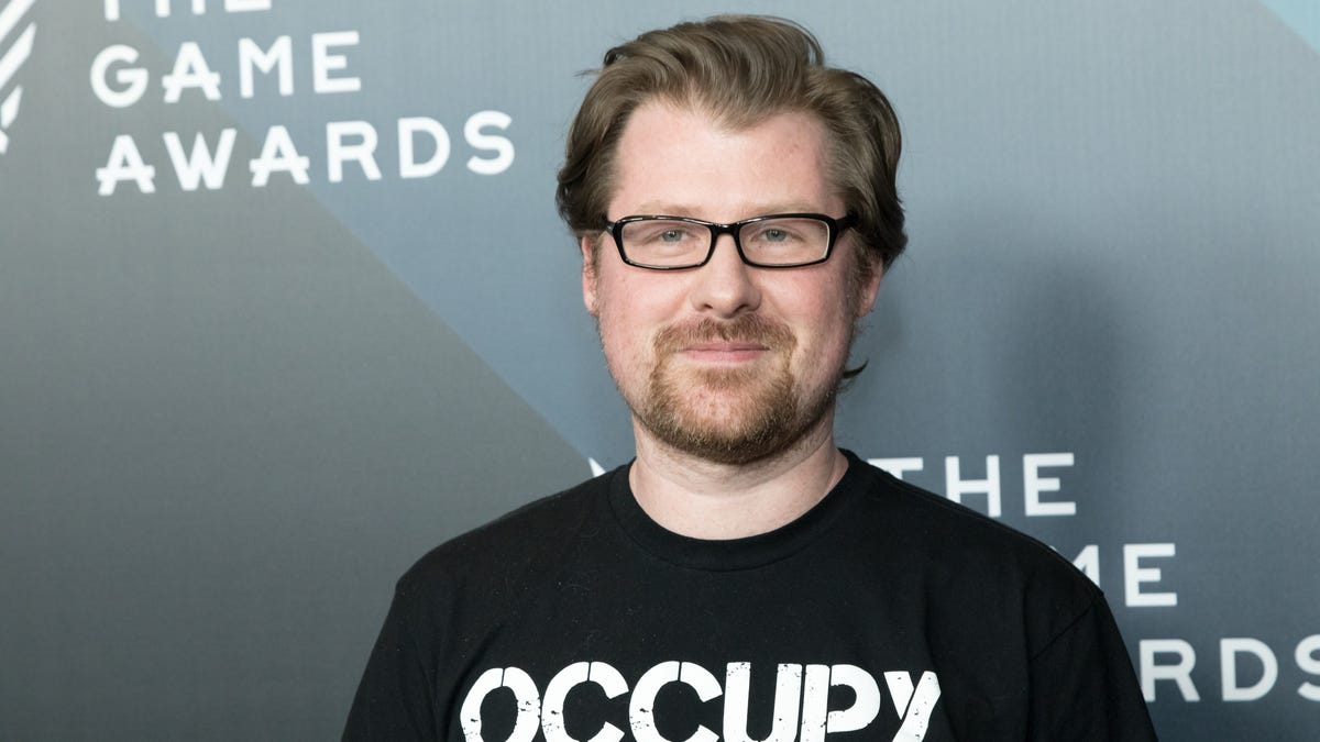 Man wearing glasses and black T-shirt