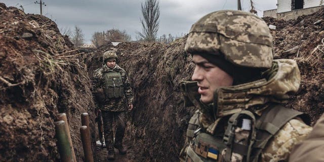 BAKHMUT, UKRAINE - DECEMBER 31: Ukrainian soldiers are seen in a trench on New Year's Eve in Bakhmut, Ukraine on December 31, 2022. 