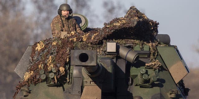 Ukrainian soldiers appear in military vehicles during the Russia-Ukraine war in Donetsk Oblast, Ukraine on Jan. 24, 2023. 