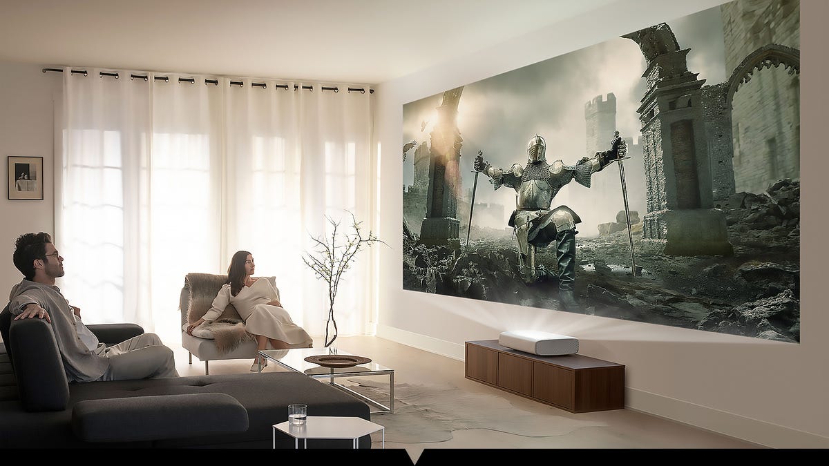 A cozy room with a huge simulated image from a small ultra-short throw projector.