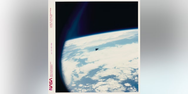 A triangular piece of orbital debris (a section of thermal insulation tile) high above the Planet Earth as seen from the Space Shuttle Columbia during mission STS-61-C, 12th to 18th of January, 1986. 