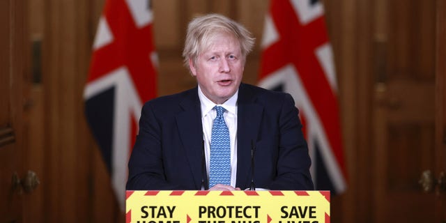 Britain's Prime Minister Boris Johnson speaks during a news conference inside 10 Downing Street in London.