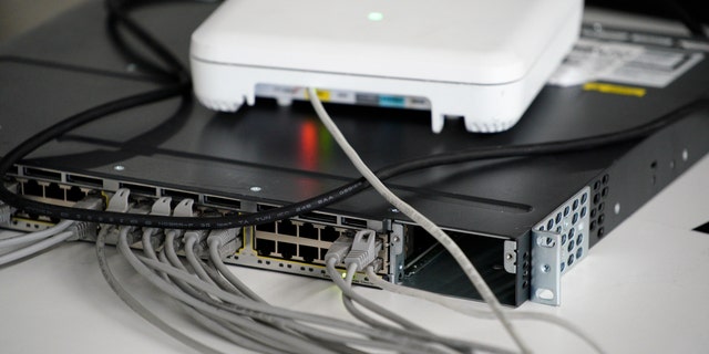 Routers with network cables are seen during the Hackyeah hackathon in Warsaw, Poland on September 18, 2019. The Hackyeah hackathon is the largest stationary hackathon in Europe with around 2500 participants taking part in an overnight hacking compeition and over 100 thousand Euros in prize money.