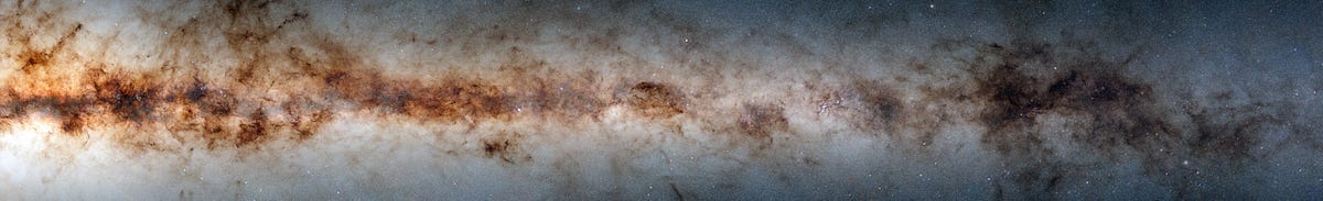 Part of the Milky Way shows thousands and thousands of stars and celestial objects. If looks like a strange, spangly cloud in shades of brown and beige.
