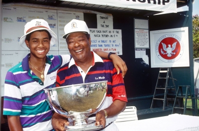 Woods and his father, Earl, celebrate after a 15-year-old Tiger won the US Junior Amateur Championship in 1991. He won the event in 1992 and 1993 as well.