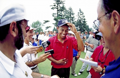 Woods talks to the media after winning his third-straight US Amateur in 1996. Throughout his life, Woods has worn red on the final day of a big tournament.