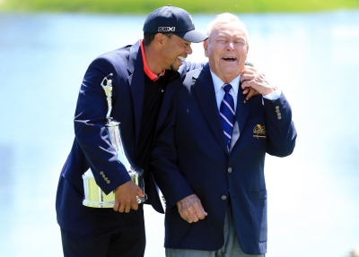 Woods jokes with golf great Arnold Palmer after winning the Bay Hill Invitational in March 2013 and regaining his spot as the world's top-ranked golfer.