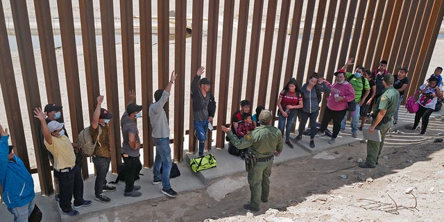 Migrants attempting to cross to the U.S. from Mexico are detained by U.S. Customs and Border Protection (CBP) at the border on August 15, 2021 in San Luis, Arizona.