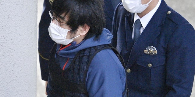 Tetsuya Yamagami, the alleged assassin of Japan's former Prime Minister Shinzo Abe, enters a police station in Nara, western Japan, on Jan. 10, 2023.