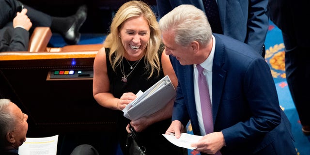 Rep. Marjorie Taylor Greene, R-Ga., left, speaks with House Minority Leader Kevin McCarthy, R-Calif., as the House votes on creating a January 6th Committee at the U.S. House Chamber of the U.S. Capitol in Washington on Wednesday, June 30, 2021.