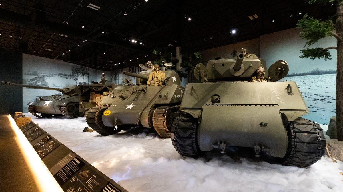 Three WWII-era tanks on a bed of fake snow.