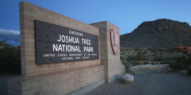 A sign marks an entrance to Joshua Tree National Park one day after the park reopened after being closed for two months due to the coronavirus pandemic on May 18, 2020, in Joshua Tree National Park, California. 