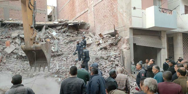 Debris removal works are underway after a five-story building collapses in Asyut, Egypt, on Jan. 8, 2023. At least six casualties were reported. It is not clear on what caused the building to crumble. 