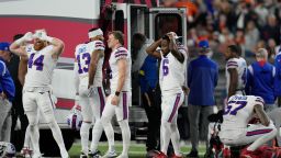 Buffalo Bills players react as teammate Damar Hamlin is examined during the first half of an NFL football game against the Cincinnati Bengals, Monday, Jan. 2, 2023, in Cincinnati. (AP Photo/Jeff Dean)
