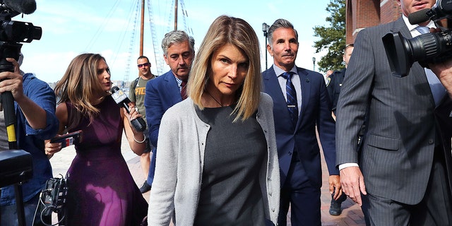Lori Loughlin photographed leaving the courthouse amid the college admissions scandal.