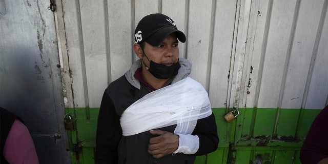 A subway passenger, injured when two subway trains collided, waits to be taken to a hospital, in Mexico City, Saturday, Jan. 7, 2023.