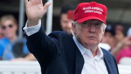 US President Donald Trump waves to well wishers as he arrives at the 72nd US Women's Open Golf Championship at Trump National Golf Course in Bedminster, New Jersey, July 15, 2017. / AFP PHOTO / SAUL LOEB        (Photo credit should read SAUL LOEB/AFP via Getty Images)