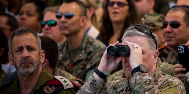 U.S. Chairman of the Joint Chiefs of Staff Mark Milley, right, and Israel's Chief of General Staff Aviv Kohavi watch a live-fire exercise at Tze'elim military base in Israel on Sept. 15, 2022.