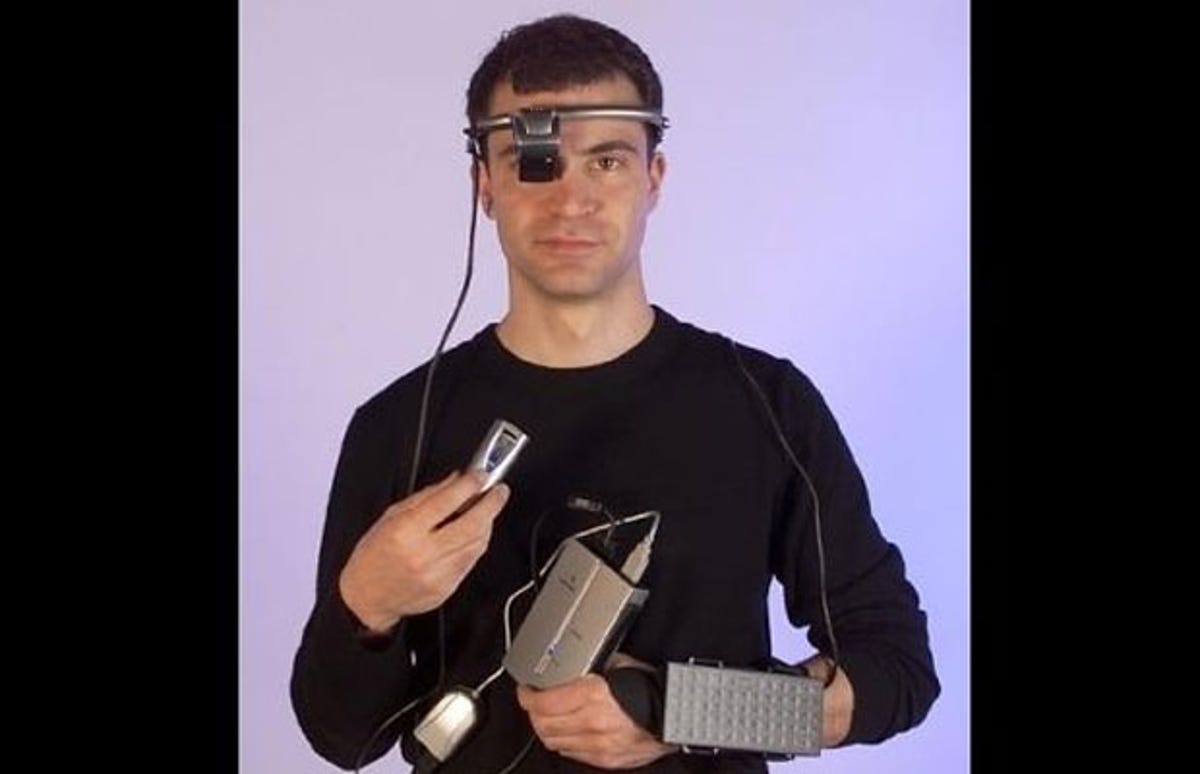 A man models the Xybernaut Poma wearable computer