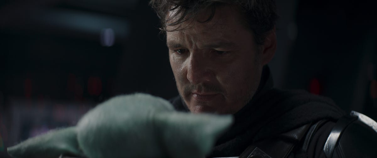 Pedro Pascal as the Mandalorian, with helmet removed