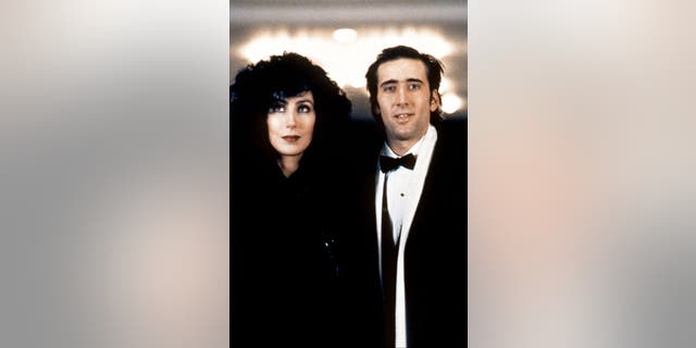 Cher and Nicolas Cage on the set of Moonstruck in 1987, directed and produced by Norman Jewison. 