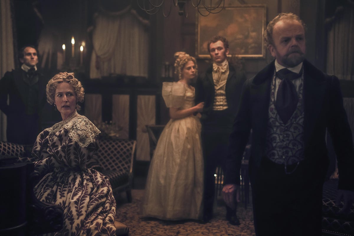 Gillian Anderson as Julia, Harry Melling as Edgar Allen Poe, Lucy Boynton as Lea, Harry Lawtey as Artemus, Toby Jones as Dr. Marquis, all standing in a candlelit room.