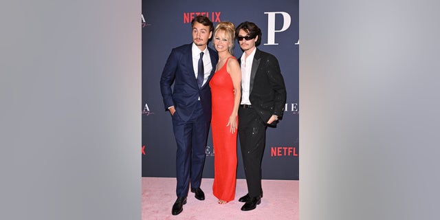 Brandon Thomas Lee, left, Pamela Anderson, and Dylan Jagger Lee attend the premiere of Netflix's "Pamela, a love story" at TUDUM Theater.