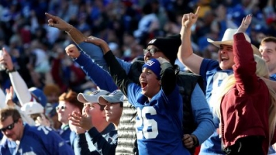 Giants fans celebrate a touchdown during the second quarter against the Colts.