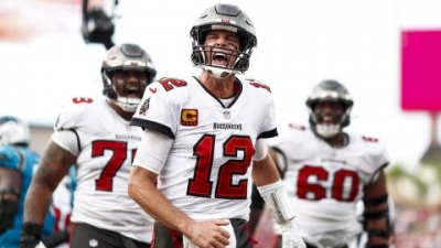 Tom Brady of the Tampa Bay Buccaneers celebrates after a touchdown during the fourth quarter of the game against the Carolina Panthers.