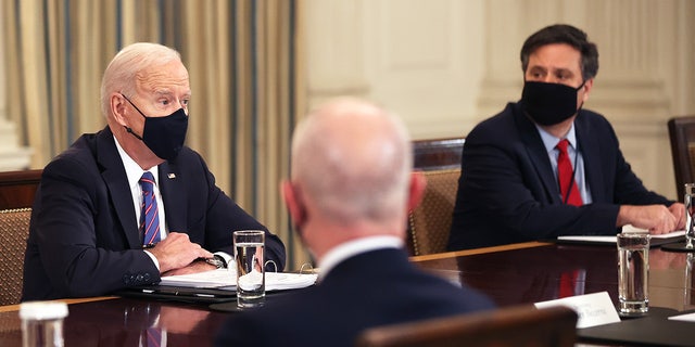 President Biden, left, and Chief of Staff Ron Klain meet with cabinet members and immigration advisors in the State Dining Room on March 24, 2021 in Washington, DC.