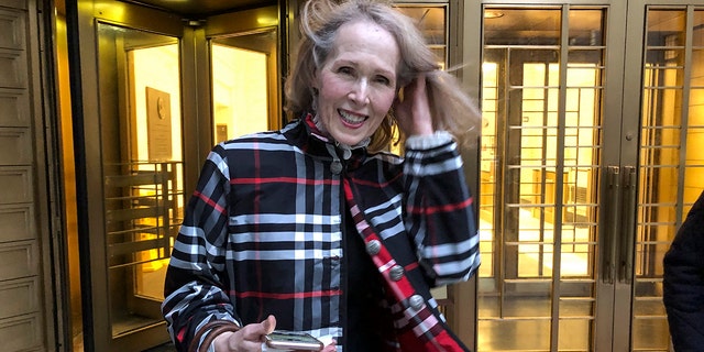 Columnist E. Jean Carroll leaves federal court, on Feb. 22, 2022, in New York. Former President Donald Trump will have to answer questions under oath next week in a defamation lawsuit lodged by the writer, who says he raped her in the mid-1990s, a judge ruled Wednesday, Oct. 12 2022. Carroll's lawsuit claims that Trump damaged her reputation in 2019 when he denied raping her. 