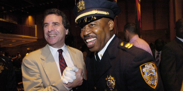 Eric Adams (right), head of 100 Blacks in Law Enforcement, shares a laugh with Norman Siegel, executive director of the Freedom Legal Defense and Education Project.