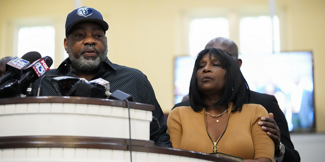 Rodney Wells, stepfather of Tyre Nichols, who died after being beaten by Memphis police officers, speaks at a news conference with civil rights Attorney Ben Crump, seen comforting Tyre's mother RowVaughn Wells, in Memphis, Tennessee, on Friday, Jan. 27.