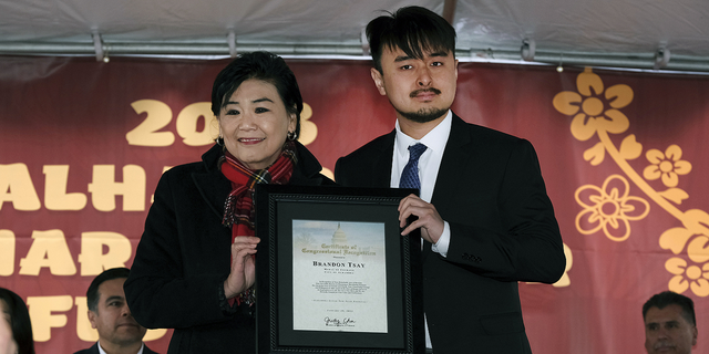 Congresswoman Judy Chu representing the 28th District of California presents Brandon Tsay with a Congressional Certificate of Recognition on Sunday, Jan. 29, in Alhambra, California.