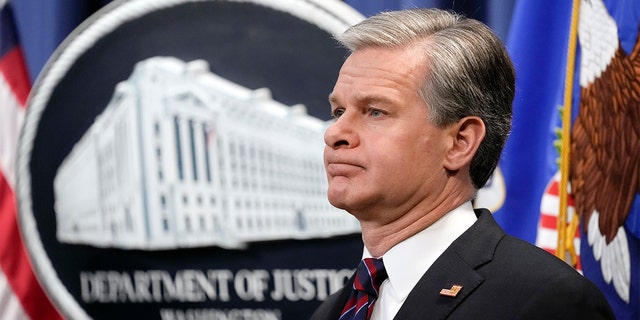 FBI Director Christopher Wray listens during a news conference at the Department of Justice in Washington, Friday, Jan. 27, 2023. 