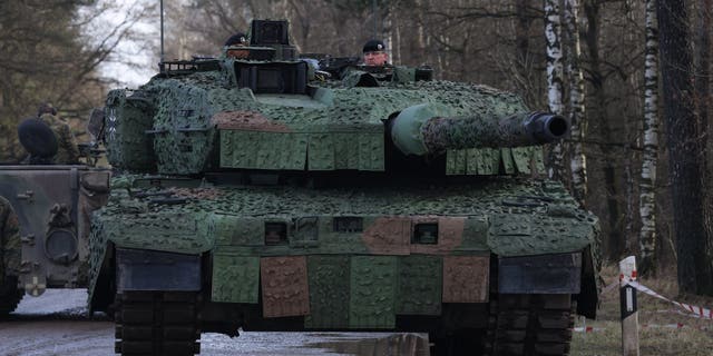 MUNSTER, GERMANY - FEBRUARY 07: A new Leopard 2 A7V heavy battle tank Bundeswehr's 9th Panzer Training Brigade stands during a visit by Defence Minister Christine Lambrecht to the Bundeswehr Army training grounds on February 07, 2022 in Munster, Germany.