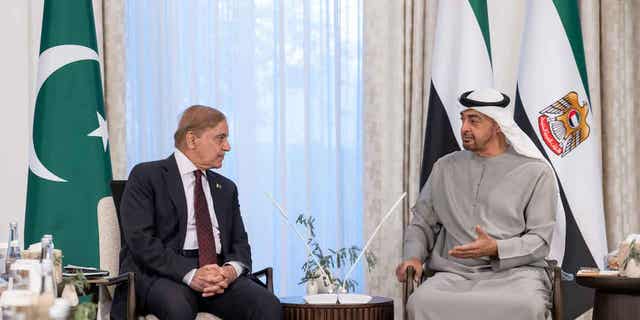 Pakistan's Prime Minister Shahbaz Sharif, left, meets with Emirati leader and Abu Dhabi ruler Sheikh Mohammed bin Zayed Al Nahyan at Al Shati Palace in Abu Dhabi, United Arab Emirates, on Jan. 12, 2023. Pakistan's prime minister said that the UAE agreed to extend a $2 billion loan to his country to help recover from the devastating summer floods.