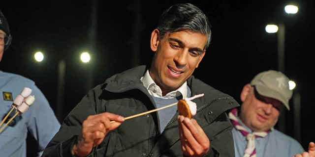Britain's Prime Minister Rishi Sunak is shown toasting marshmallows in Muirtown near Inverness, Scotland, on Jan. 12, 2023. Sunak pledged to work constructively with Scottish First Minister Nicola Sturgeon during his trip to the country.