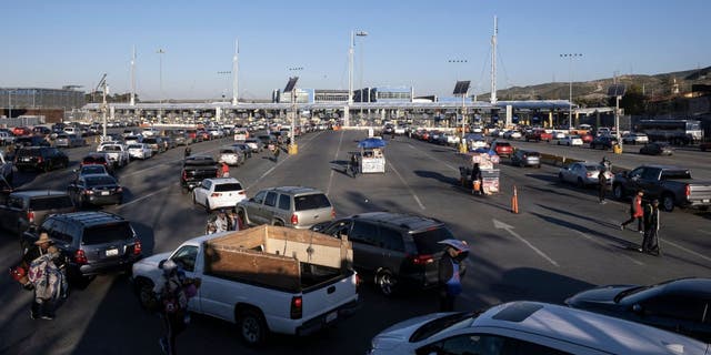 Cars queue at the San Ysidro crossing port on the U.S.-Mexico border in Tijuana, Baja California state, Mexico, on Dec. 19, 2022