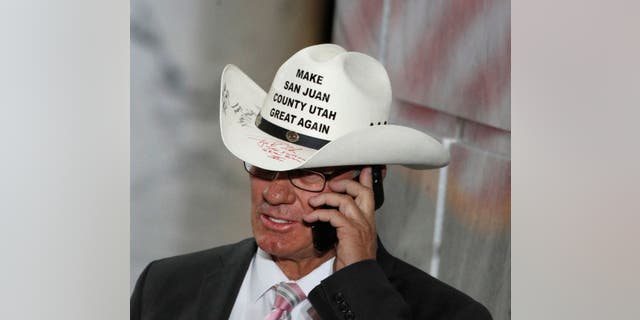 Bruce Adams, Chairman of the San Juan County Commission, talks on the phone before a event with U.S. President Donald Trump at the Rotunda of the Utah State Capitol on December 4, 2017 in Salt Lake City, Utah. (George Frey/Getty Images)