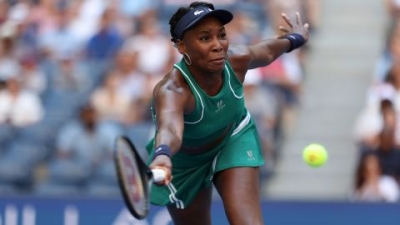 Venus Williams stretches to make a shot during a US Open women's singles match Tuesday.