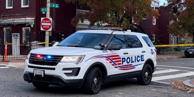 A Metropolitan Police SUV parks near police tape in Washington, D.C.