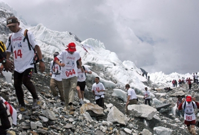 strongEverest: /strongIt's hard to imagine climbing Mount Everest -- let alone running it. But that's what hundreds of marathon runners have been doing each year since 2003. Pictured: runners compete in the Everest Hillary Marathon across Everest's Base Camp, in 2006.