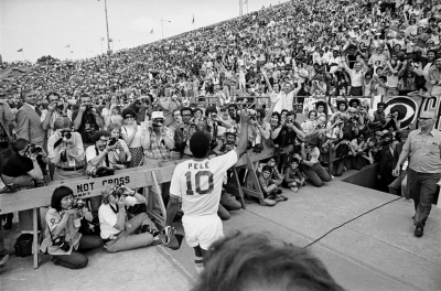 Pelé waves to the crowd before making his debut with the New York Cosmos in 1975. He signed a $1.4 million a year contract with the Cosmos and made a big splash in the emerging league.