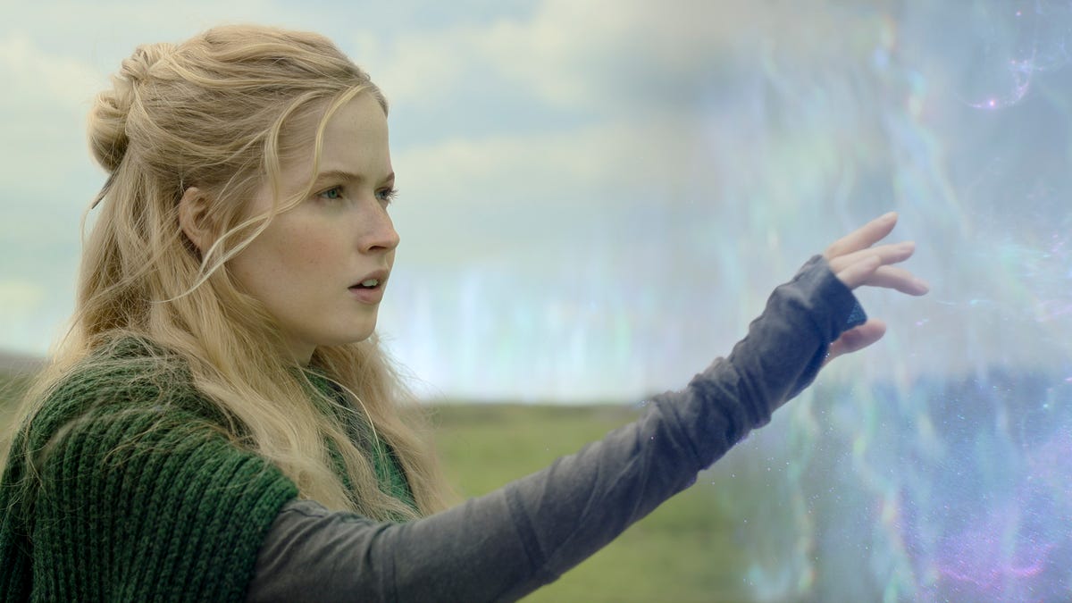 Dove/Elora Danan touches a magical forcefield in a green field in Willow