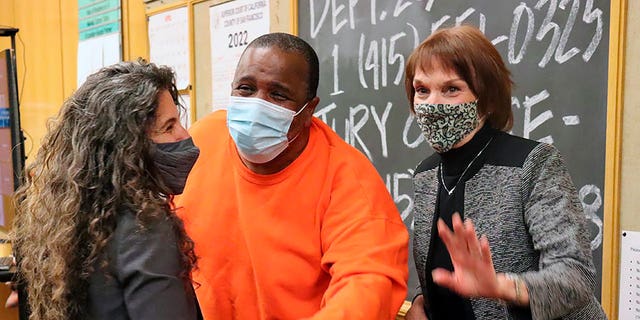 Attorney Paige Kaneb, of Northern California Innocence Project, left, Joaquin Ciria, center, and attorney Ellen Eggers react as Ciria is exonerated in San Francisco Superior Court on April 18, 2022.