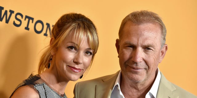 Christine Baumgartner and Kevin Costner arrive at the "Yellowstone" premiere.
